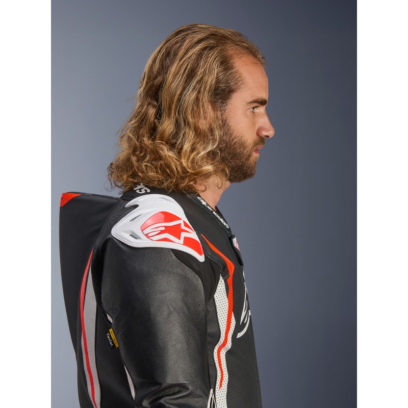 Jednoczęściowy skórzany kombinezon motocyklowy Alpinestars GP TECH V5 w kolorze czarno-biało-fluo-czerwonym